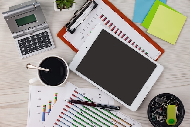 A calm desk with paperwork neatly organised